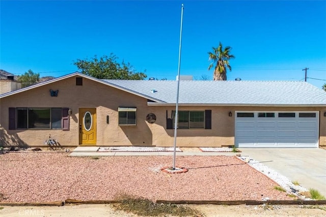 6818 El Sol Ave Unit 29, Palms, CA 92277 - single story home featuring driveway, an attached garage, stucco siding, and roof with shingles
