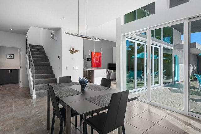 tiled dining room with sink