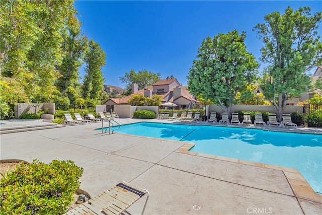 view of swimming pool featuring a patio