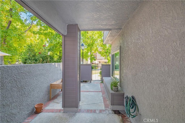 view of patio / terrace with a gate