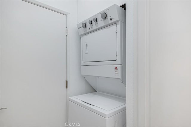 laundry room featuring laundry area and stacked washer and clothes dryer