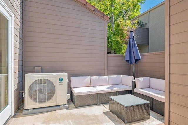 view of patio featuring outdoor lounge area and ac unit