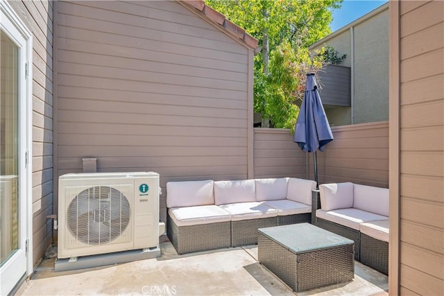 view of patio / terrace featuring an outdoor hangout area, ac unit, and fence