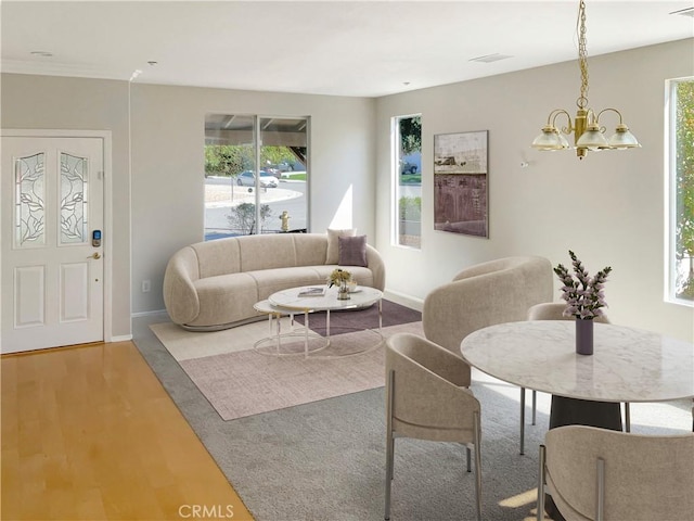 living room featuring hardwood / wood-style flooring and an inviting chandelier