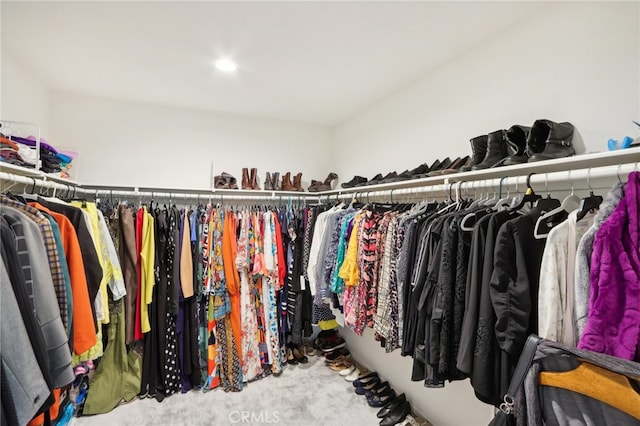 walk in closet featuring carpet