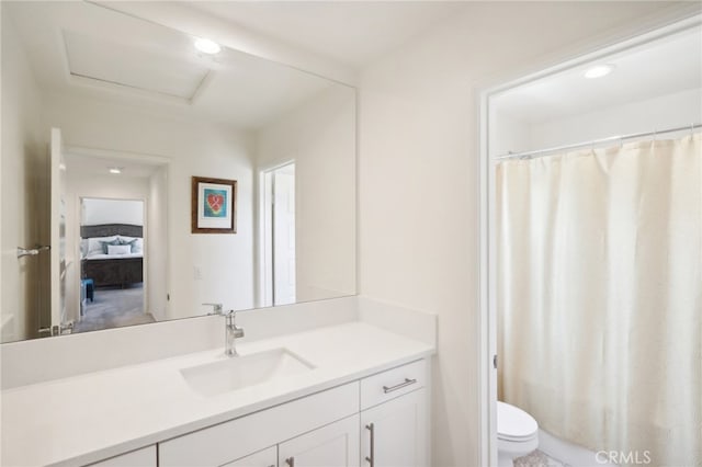 bathroom with vanity and toilet