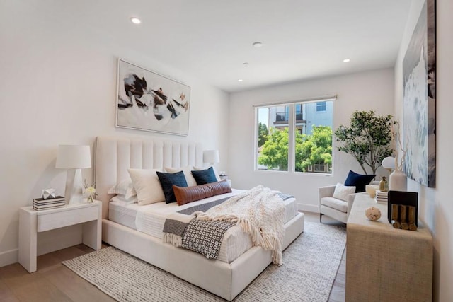 bedroom with light hardwood / wood-style floors