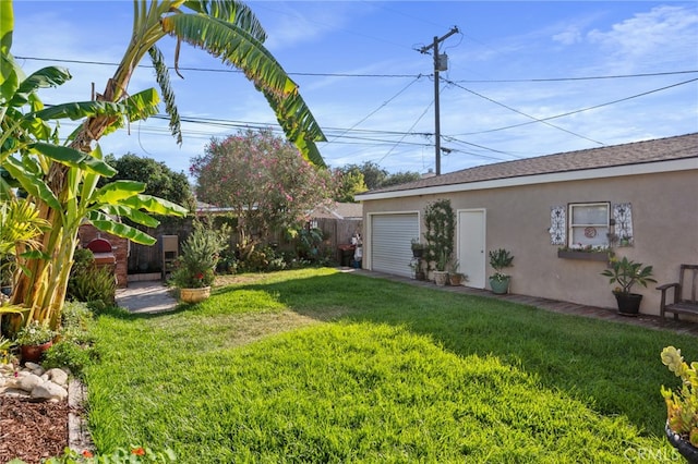 view of yard featuring a garage