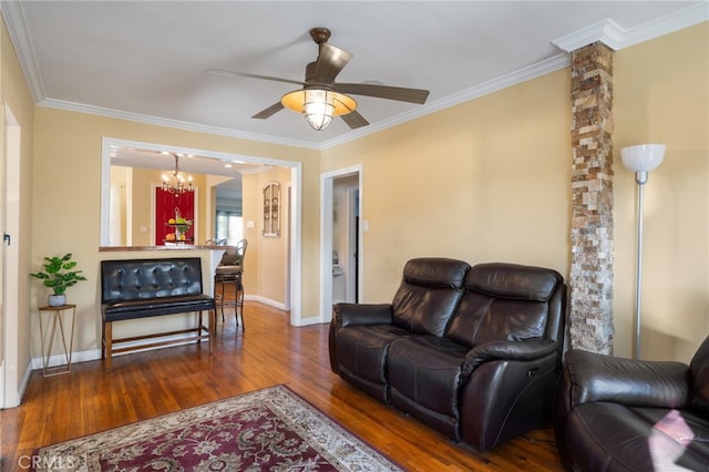 living room featuring ceiling fan with notable chandelier, crown molding, and hardwood / wood-style floors