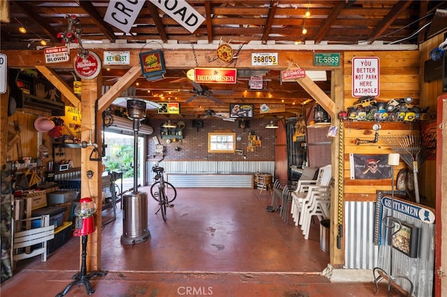 garage featuring ceiling fan and a workshop area