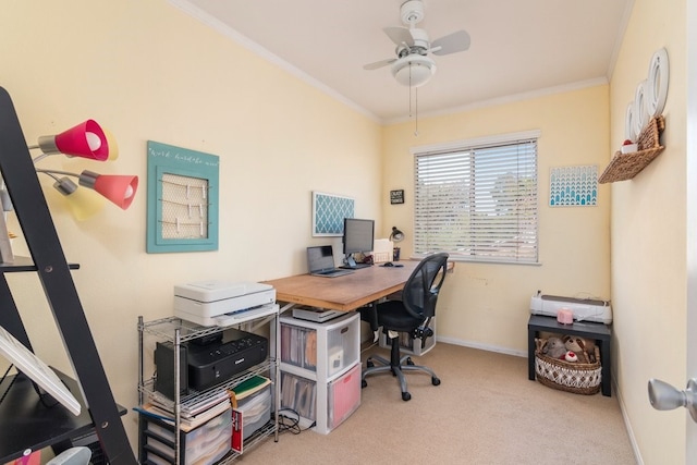 carpeted office space with ceiling fan and crown molding