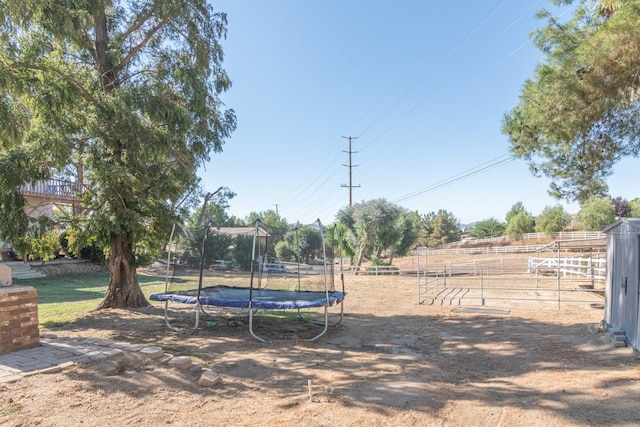 view of yard featuring a trampoline