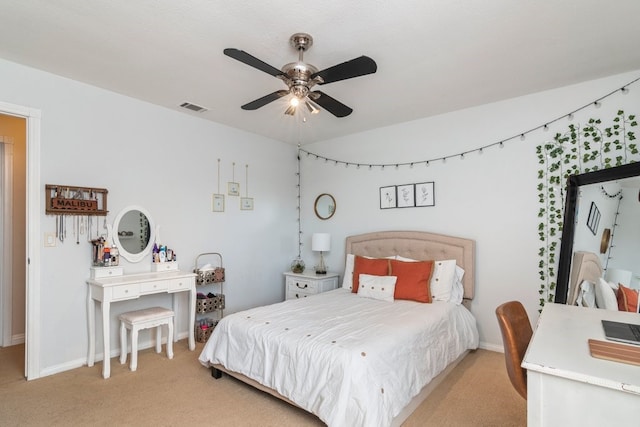 bedroom with ceiling fan and light colored carpet