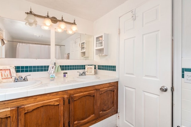 bathroom featuring decorative backsplash, vanity, and a shower with shower curtain