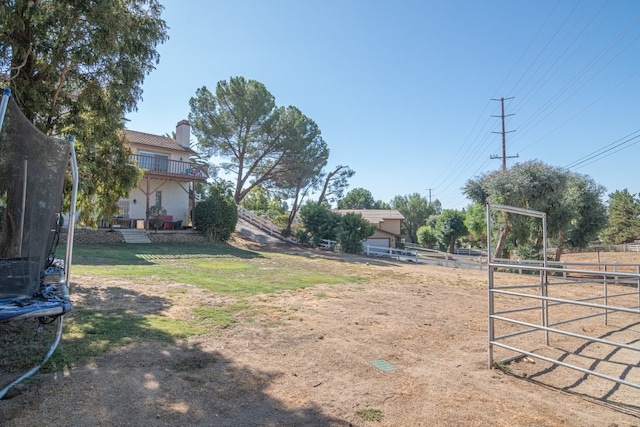 view of yard with a trampoline