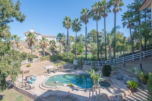 view of pool featuring a patio area