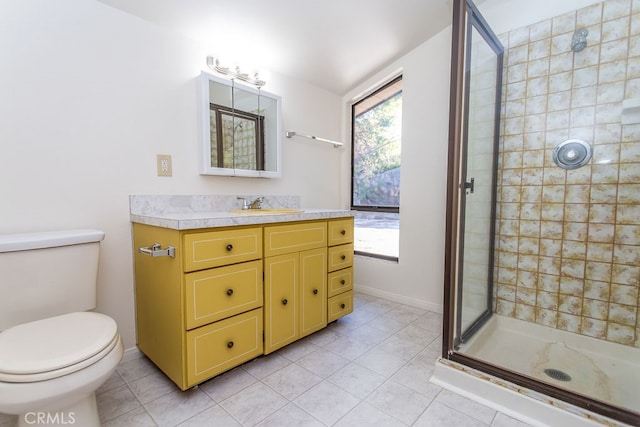 bathroom featuring vanity, a shower with shower door, toilet, and tile patterned floors