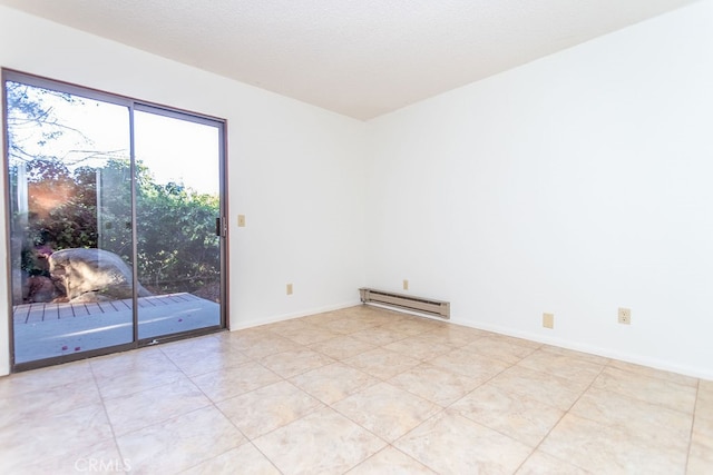 unfurnished room with light tile patterned flooring, baseboard heating, and a textured ceiling