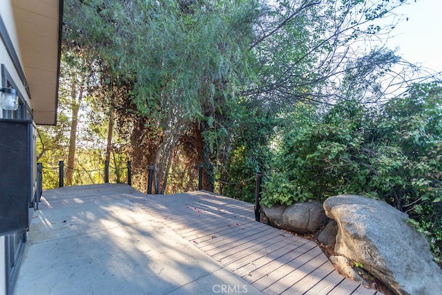 wooden deck with a patio