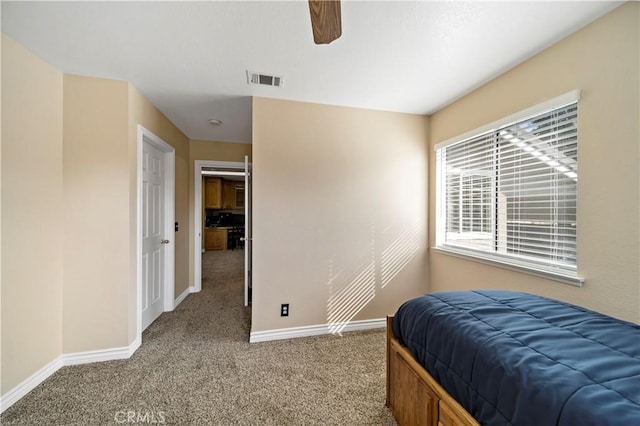 bedroom with ceiling fan and carpet flooring