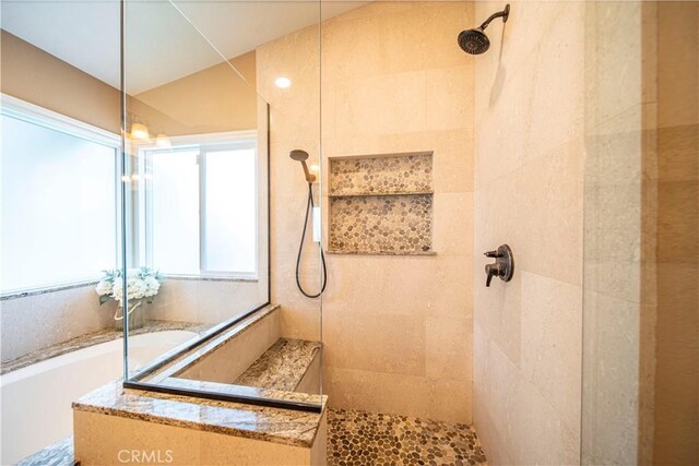 bathroom featuring a tile shower