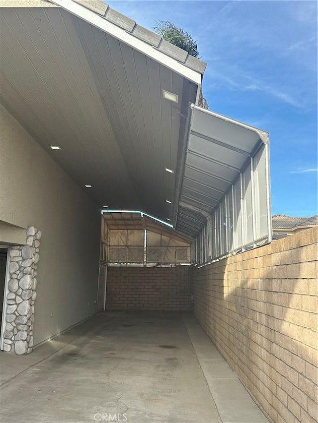 view of side of home featuring a carport