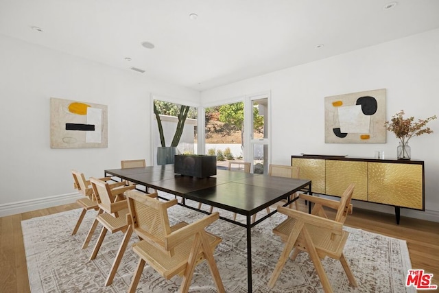 dining room with hardwood / wood-style floors