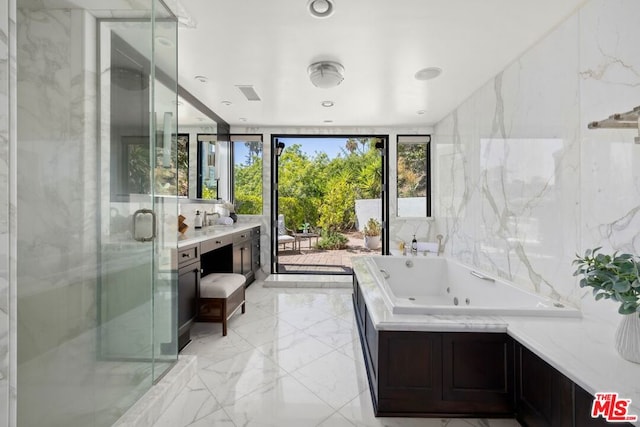 bathroom with vanity and plus walk in shower