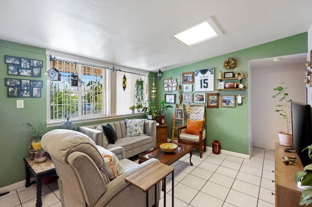 living room featuring a textured ceiling and light tile patterned floors