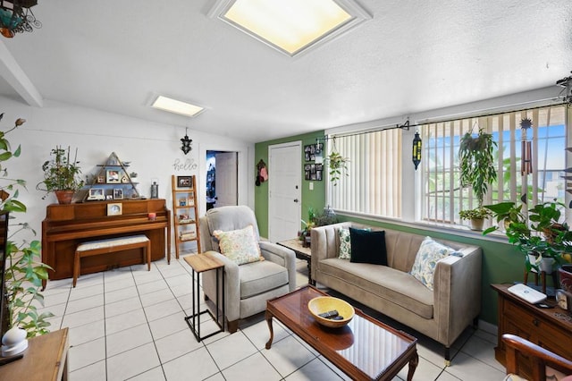 living room with vaulted ceiling, a textured ceiling, and light tile patterned floors