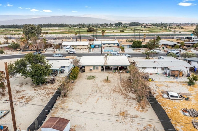 drone / aerial view featuring a mountain view