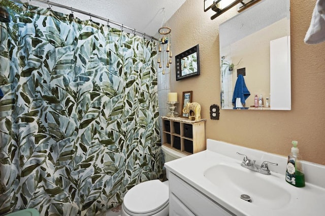 bathroom with vanity, toilet, and curtained shower