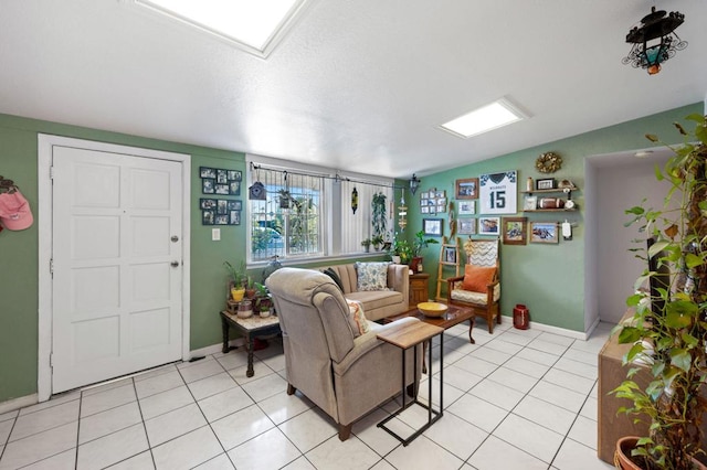 living room featuring lofted ceiling and light tile patterned flooring