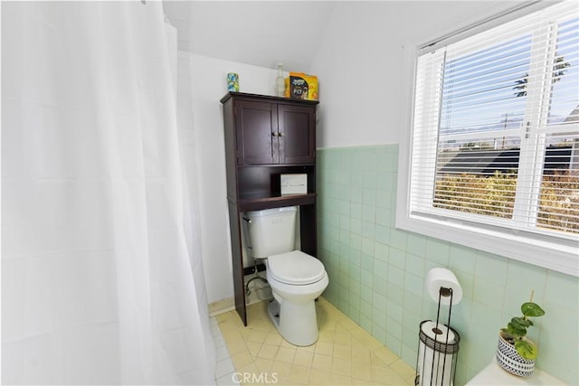 41695 Mayberry Ave, Hemet, CA 92544 - bathroom with toilet, tile patterned floors, tile walls, and curtained shower