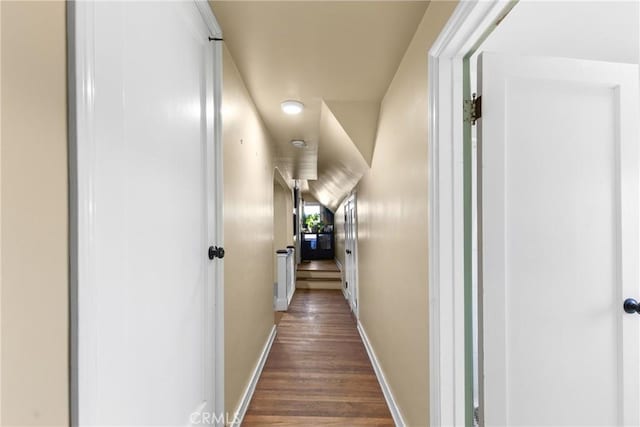 hall with dark hardwood / wood-style floors