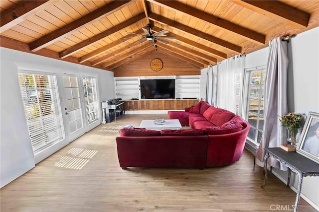 living room featuring ceiling fan, light hardwood / wood-style floors, lofted ceiling with beams, and wooden ceiling