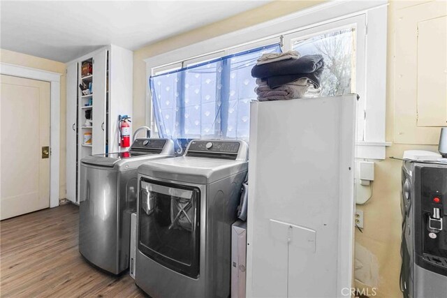 41695 Mayberry Ave, Hemet, CA 92544 - laundry area with washing machine and clothes dryer and wood finished floors