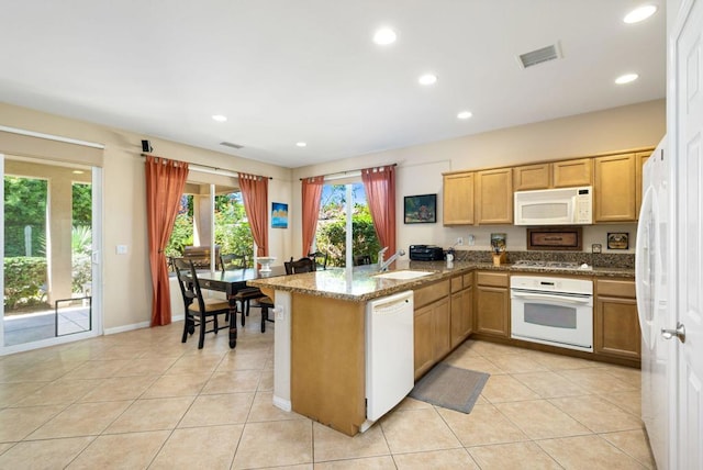 kitchen featuring kitchen peninsula, sink, white appliances, light tile patterned floors, and stone countertops