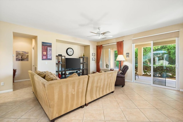 tiled living room featuring ceiling fan