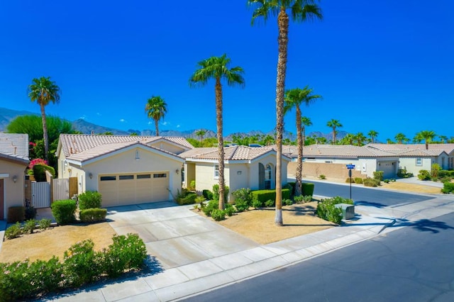 view of front of property featuring a mountain view and a garage