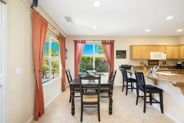 view of tiled dining space