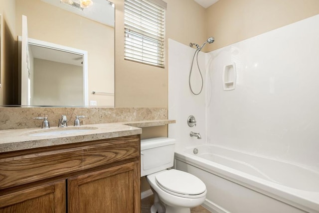 full bathroom with shower / bathing tub combination, vanity, and toilet