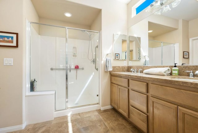 bathroom with an enclosed shower and vanity