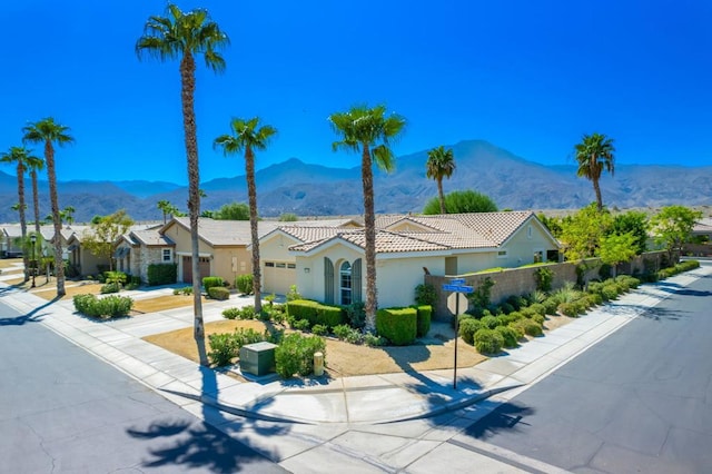 view of front of home featuring a mountain view