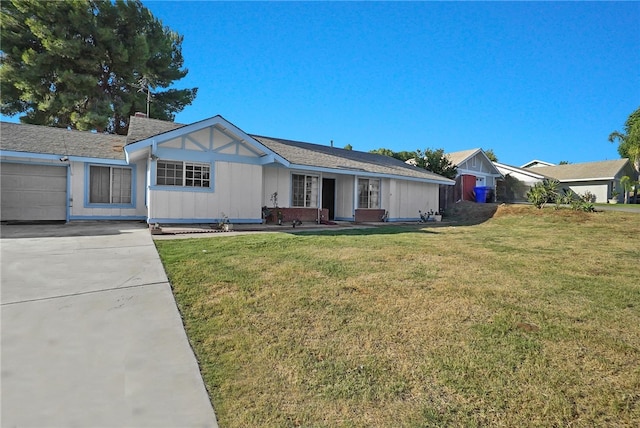 single story home featuring a front yard and a garage