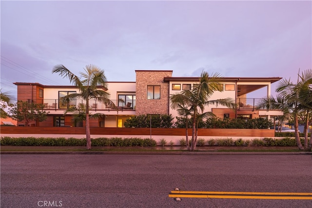 view of outdoor building at dusk