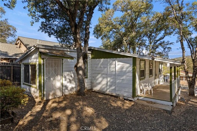 view of side of property featuring a deck