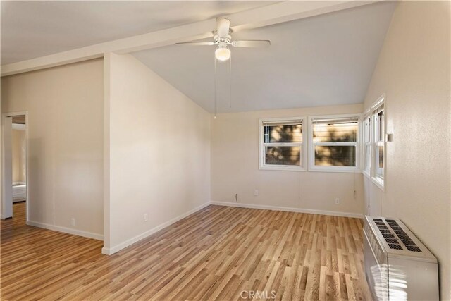 interior space with heating unit, ceiling fan, high vaulted ceiling, and light wood-type flooring