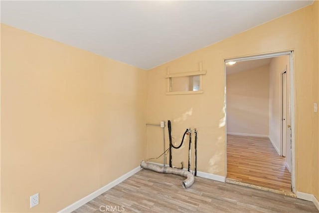 laundry area featuring washer hookup and light hardwood / wood-style floors