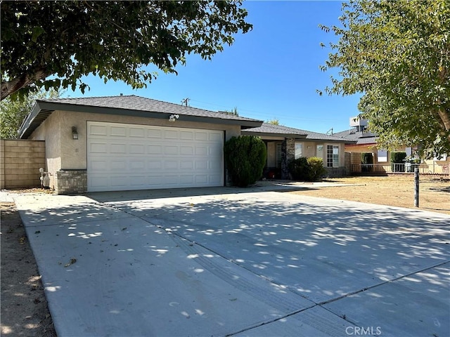 ranch-style house featuring a garage